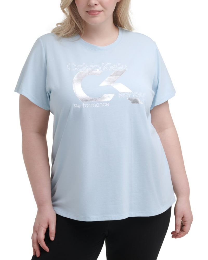 Front of a model wearing a size 1X Calvin Klein Women's Performance Plus Foil Logo Pullover Top Aqua Size 1X in Blue by Calvin Klein. | dia_product_style_image_id:311202